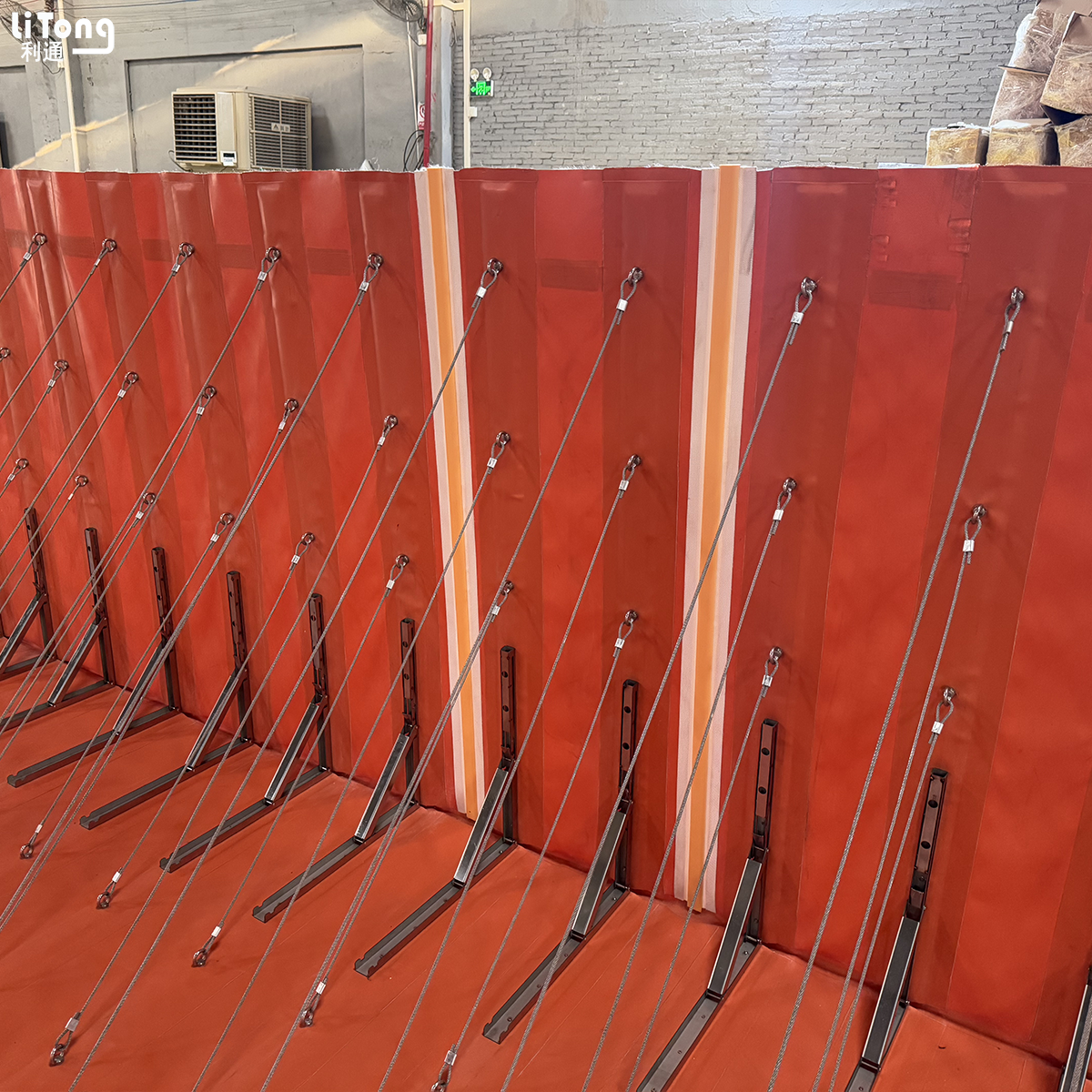 Retractable flood barrier with gate
