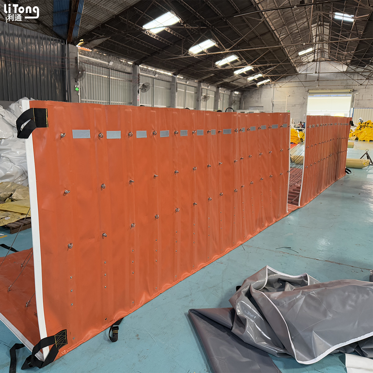 Retractable flood barrier with gate