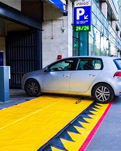 Flexible flood barrier protecting underground garage entrance