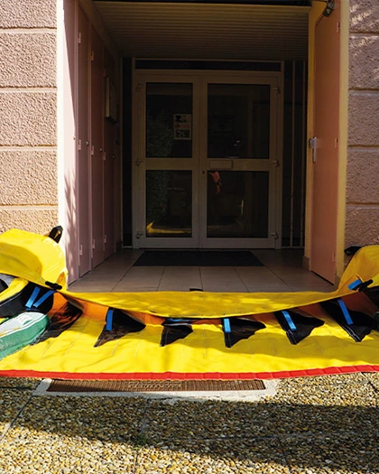 Portable flood barrier installed at residential house entrance